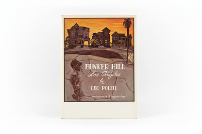 Book cover of 'Bunker Hill Los Angeles' by Leo Politi on a wooden surface.